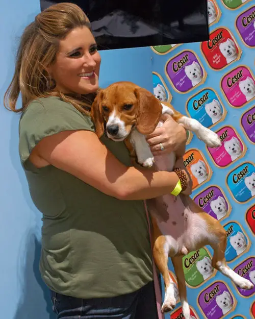 KayCee Stroh carrying her Beagle