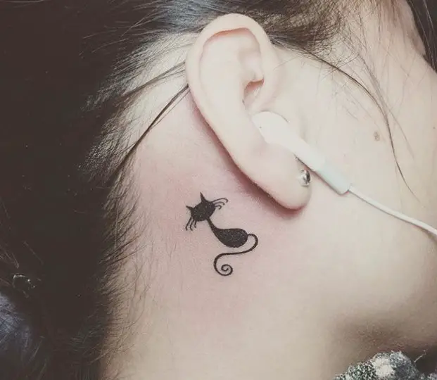 minimalist black cat tattoo behind the ears
