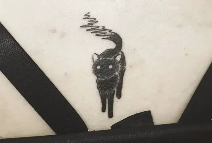 black cat tattoo at the back