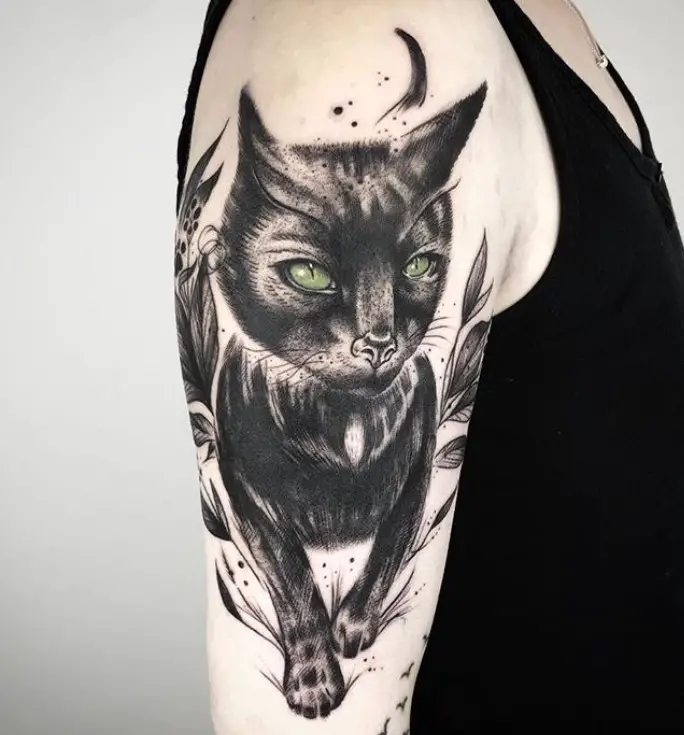 big sleek cat tattoo on shoulder