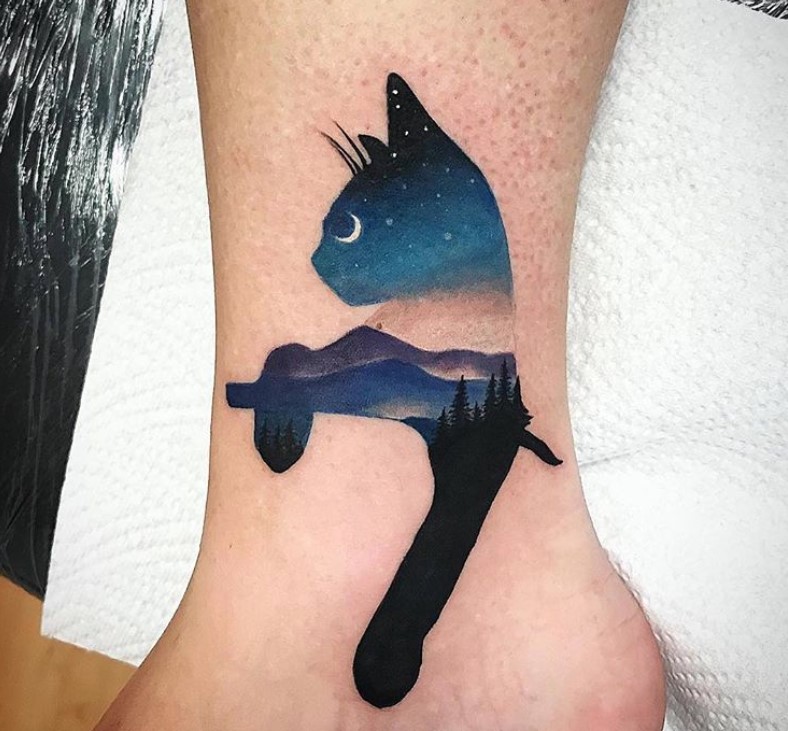 cat with night silhouette tattoo on ankle