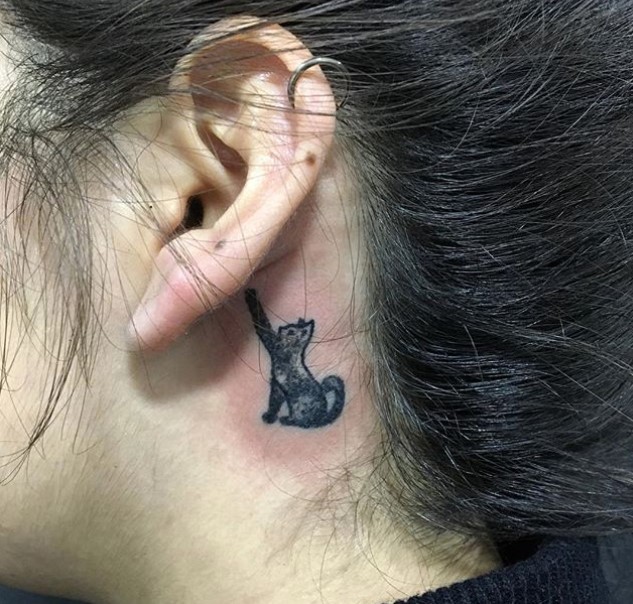 black cat tattoo behind the ears