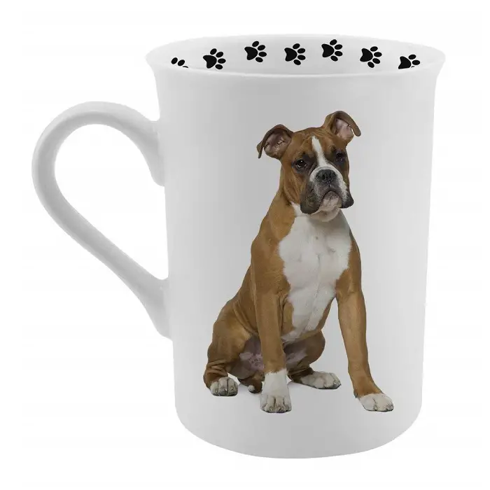 A white mug with Boxer print and black paw prints