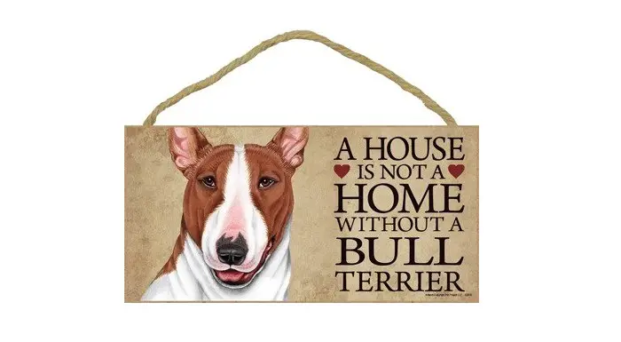 A wood sign plaque with the face of a Bull Terrier and with quote- A house is not a home without a Bull Terrier