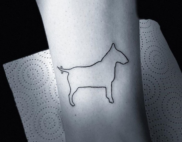 outline of a sideview standing Bull Terrier tattoo on the leg