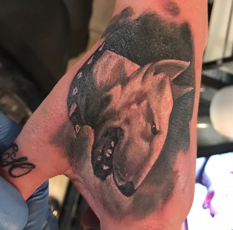 3D sideview face of a Bull Terrier tattoo on hand
