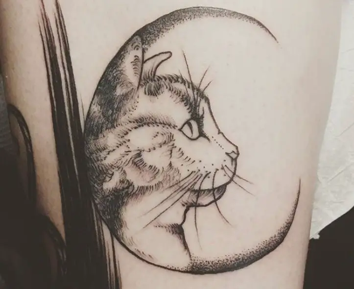 crescent moon with cat face tattoo