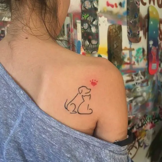 outline of sitting dog and cat tattoo on the shoulders