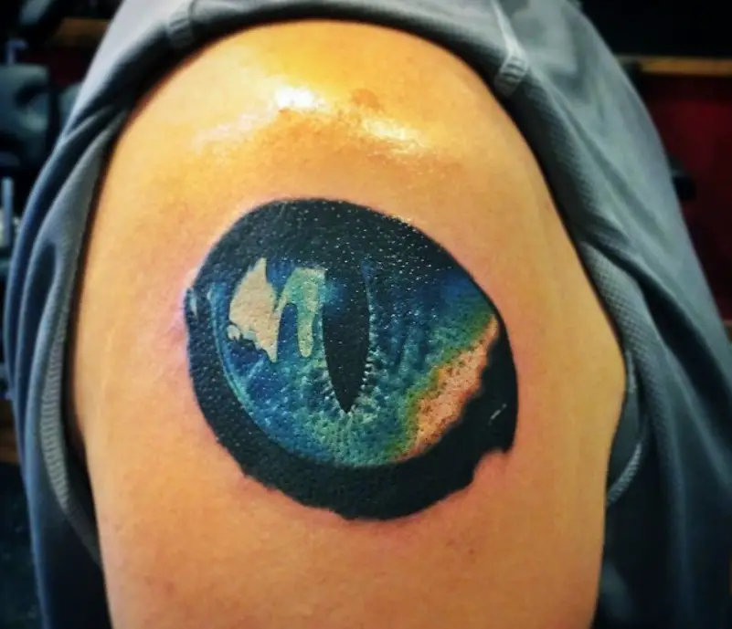 large Cat's Eye in galaxy design tattoo on the shoulder