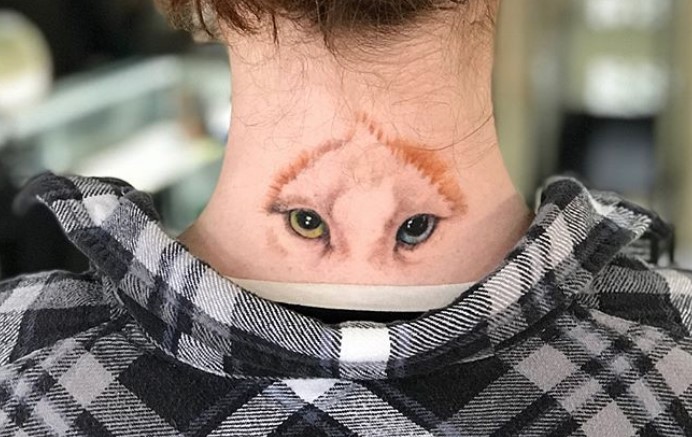 Cat Eyes tattoo on the back of the neck of a girl wearing black and white checkered polo