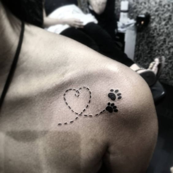 tow paws with short lines formed into heart tattoo on shoulders