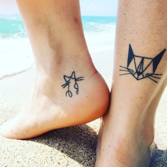 geometric and simple outline of a cat tattoo on both feet