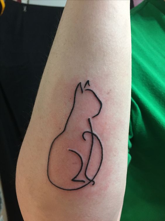 outline of a sitting cat tattoo on the forearm