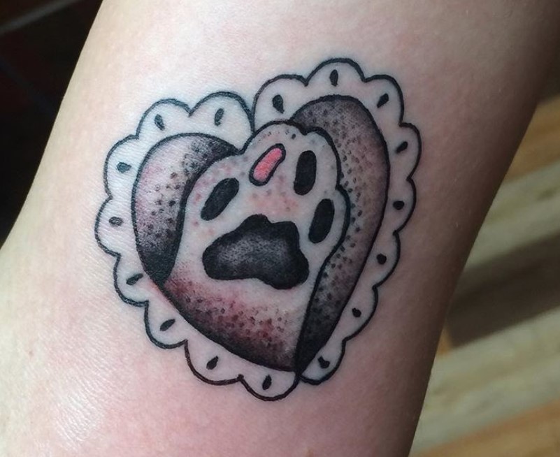 Cat Paw Print inside a heart shaped frame tattoo