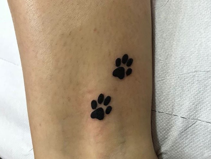 two small Cat Paw Prints tattoo