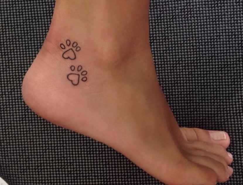 outline of Cat Paw Print tattoo on the ankle