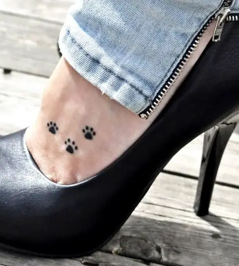 minimalist three Cat Paw Prints tattoo on the feet