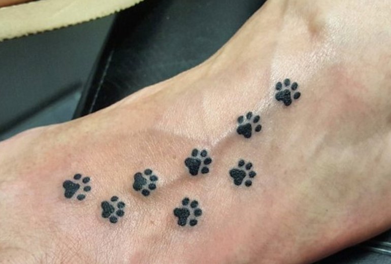 small Cat Paw Prints tattoo on the feet