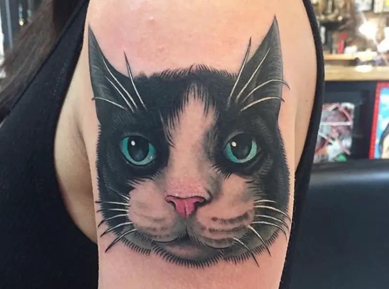 face of a realistic Cat Portrait Tattoo on the shoulder