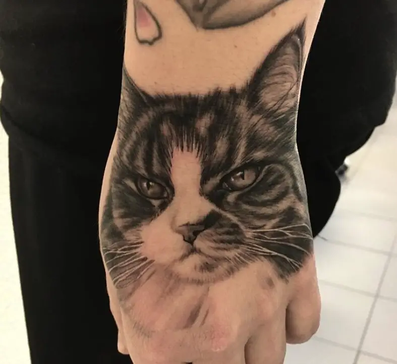 A 3D Cat Portrait Tattoo on the hand