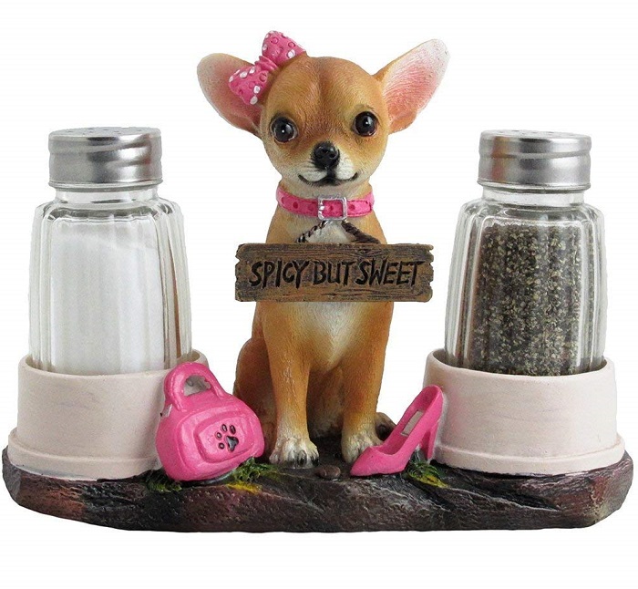 A salt and pepper shaker set with a Chihuahua figurine in the middle