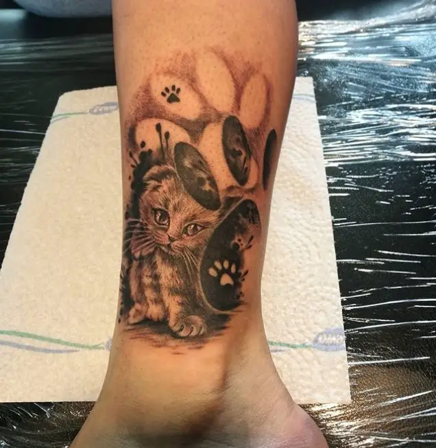 3D kitten tattoo on the leg