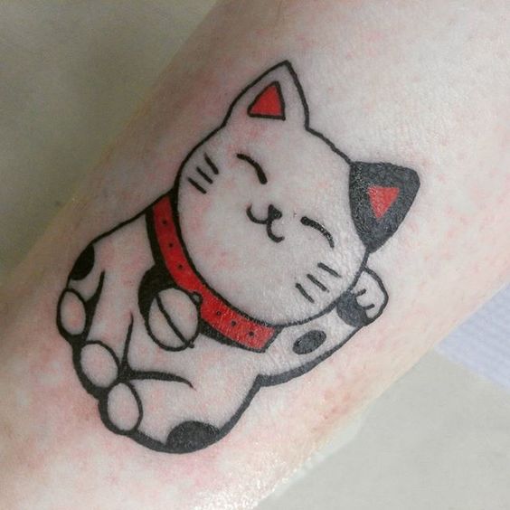 lucky white cat tattoo on the leg