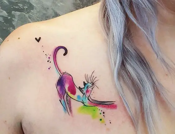 a colorful stretching cat sketch tattoo on the chest
