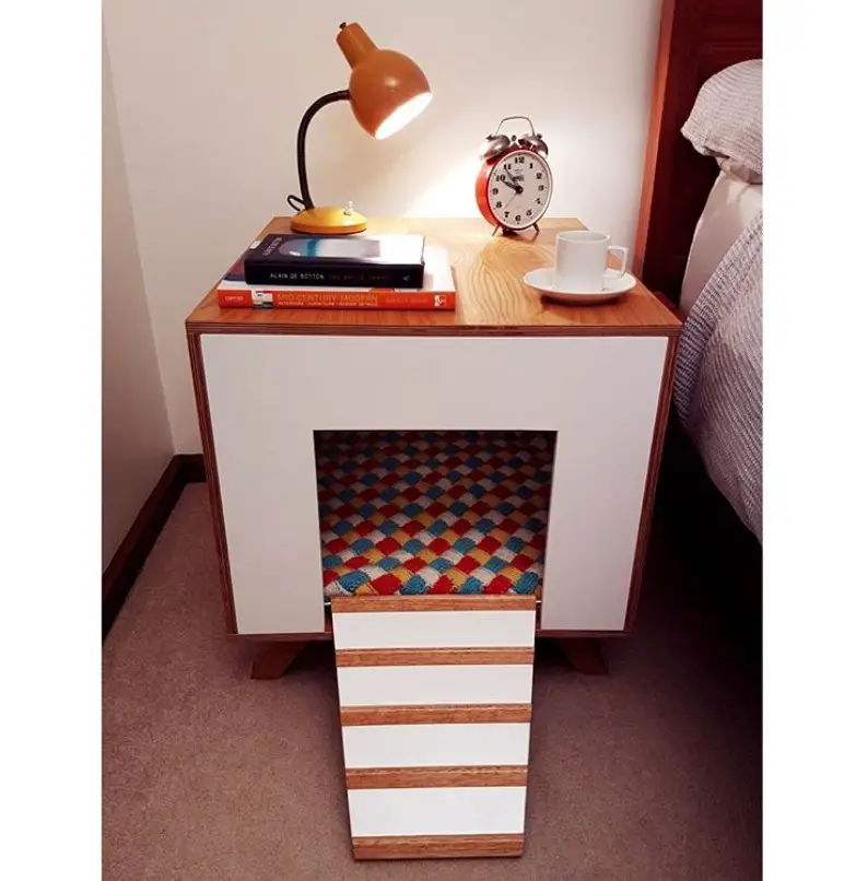 colorful side table wooden dog crate beside the bed