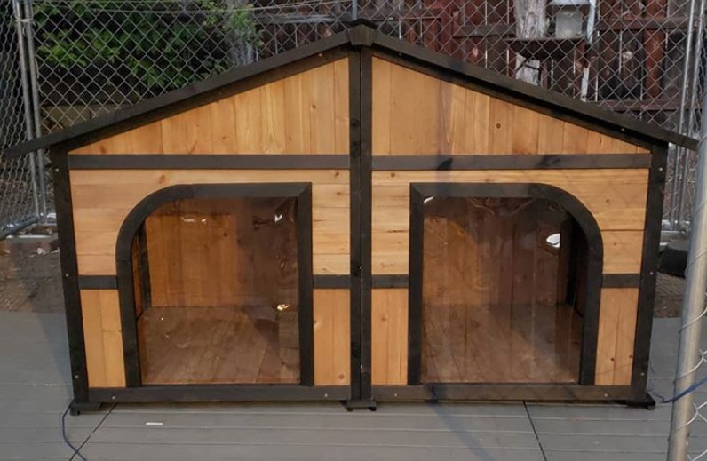 A modern Dog House made of wood and steel
