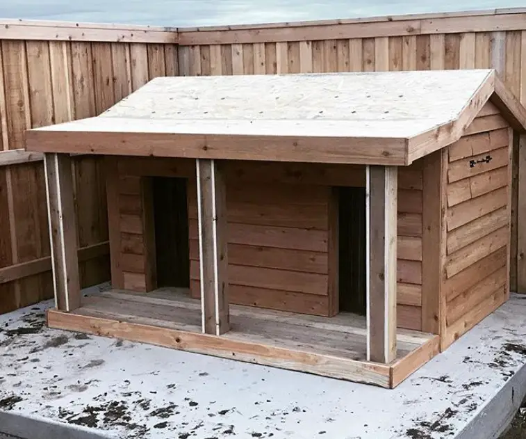 A large wooden dog house 