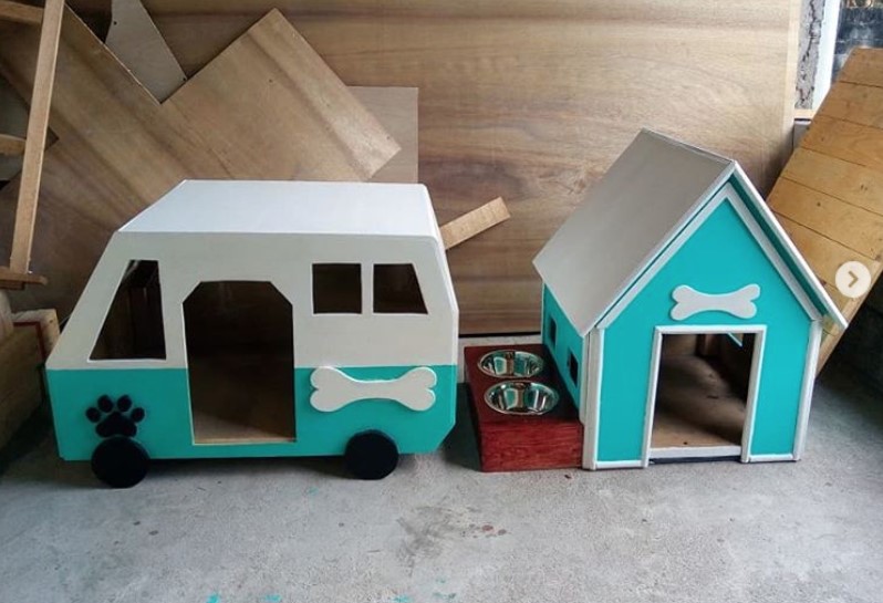 A white and blue dog house in house and car shape
