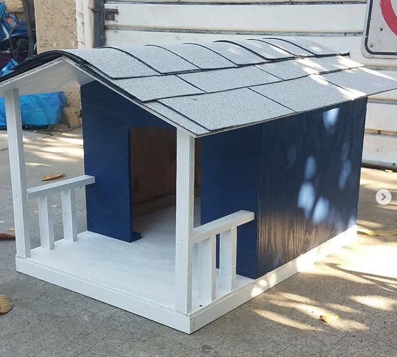 Blue and gray wooden Dog house