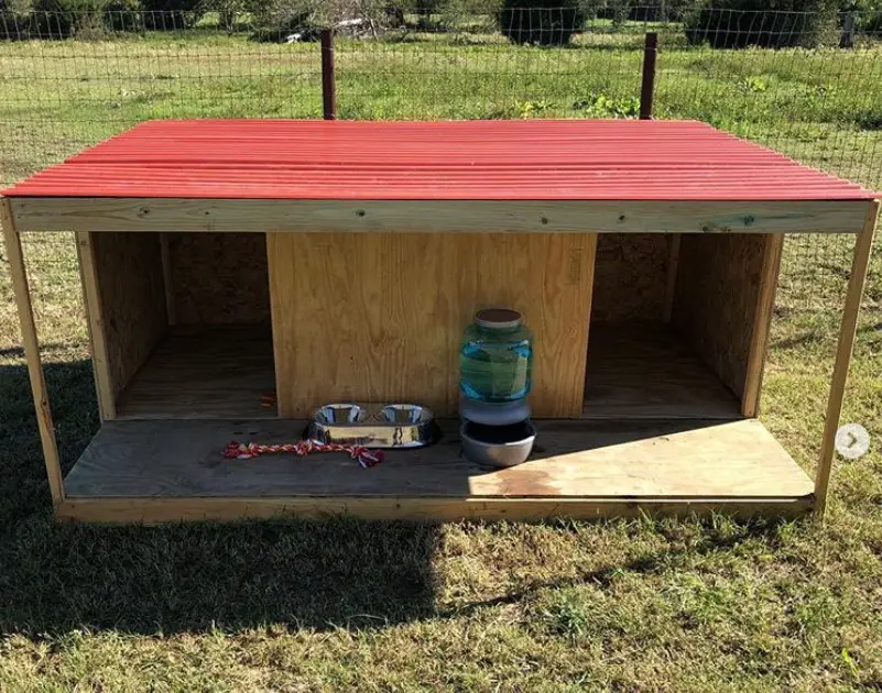 A newly built wooden dog house for two dogs