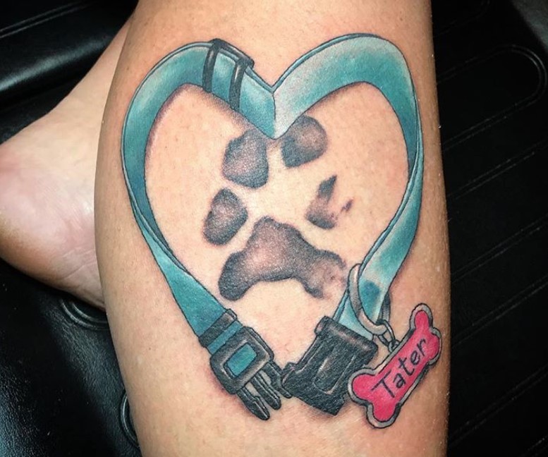 paw print inside a heart shaped blue collar with a bone shaped pet tag tattoo