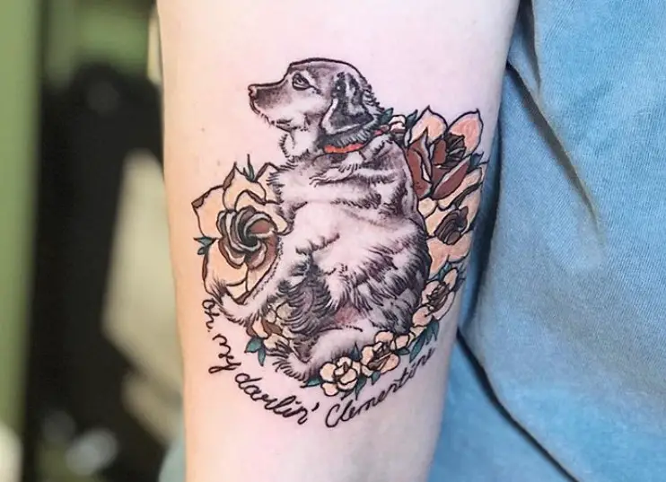 dog sitting on the flowers tattoo on forearm