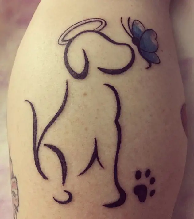 outline of dog with a halo and butterfly tattoo