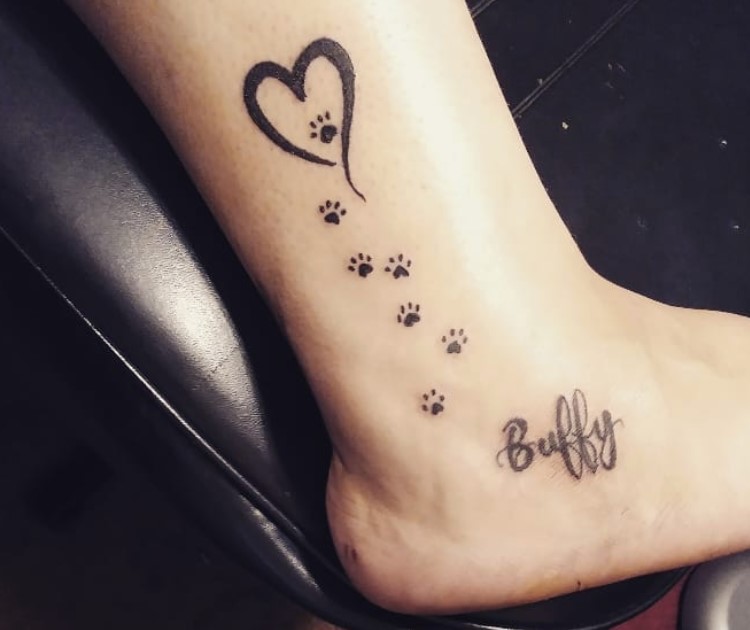 small paw prints, hearts and name tattoo on ankle