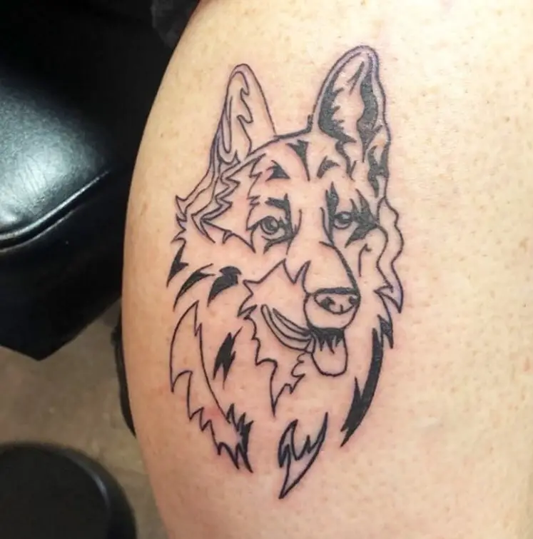 Outline head of a German Shepherd with its tongue sticking out tattoo on the leg