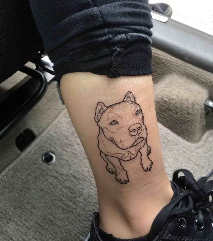 outline of a big dog sitting tattoo on the ankle