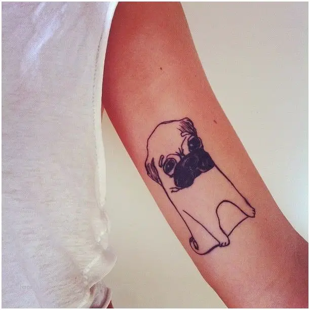 outline of a sitting pug tattoo on the biceps