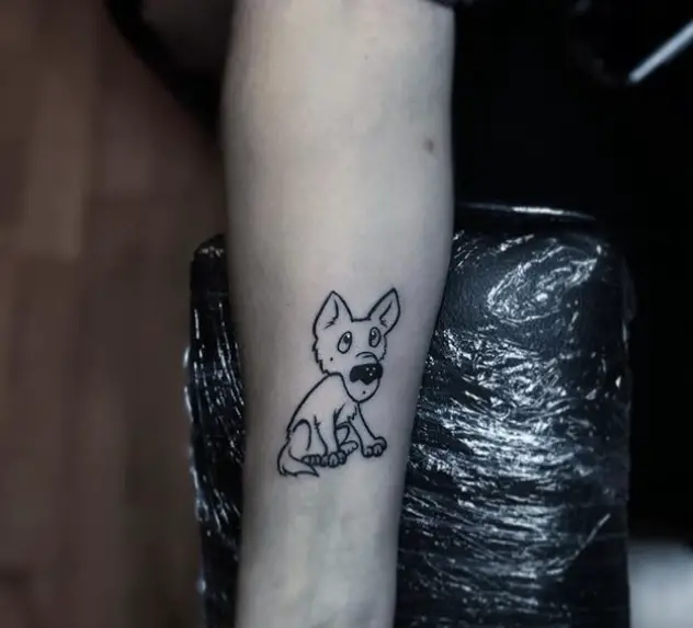 outline of an animated sitting dog tattoo on the wrist