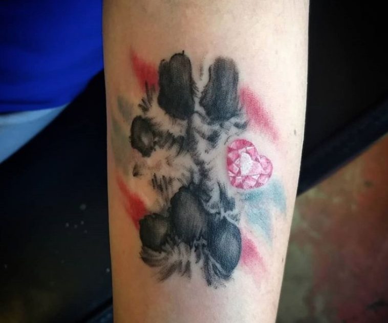 black paw print with gem heart tattoo