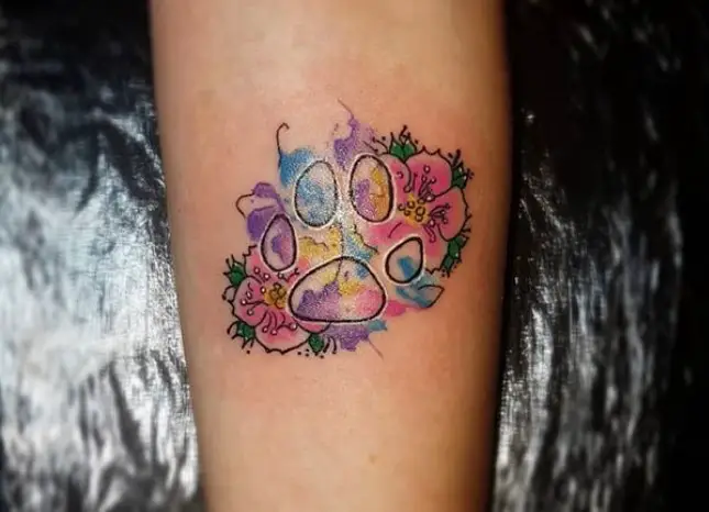 colorful paw print with flowers tattoo