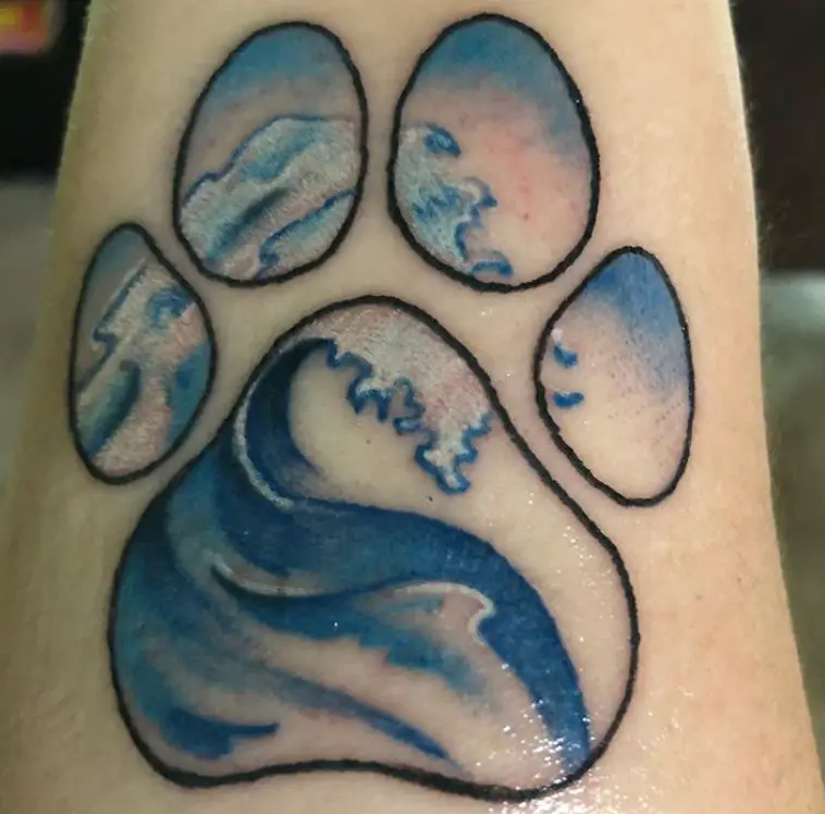ocean in paw print tattoo
