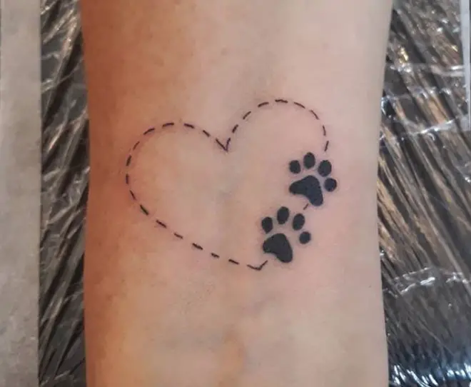 heart shaped short lines with paw prints tattoo