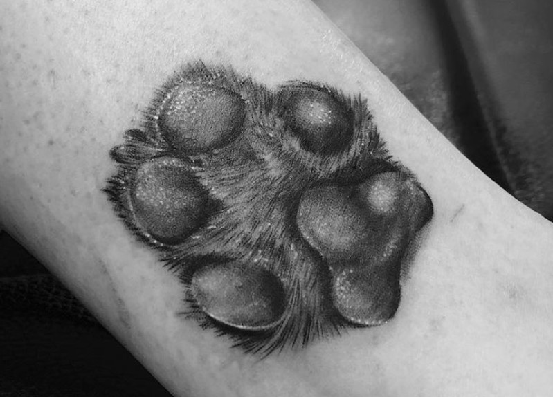 realistic paw print tattoo