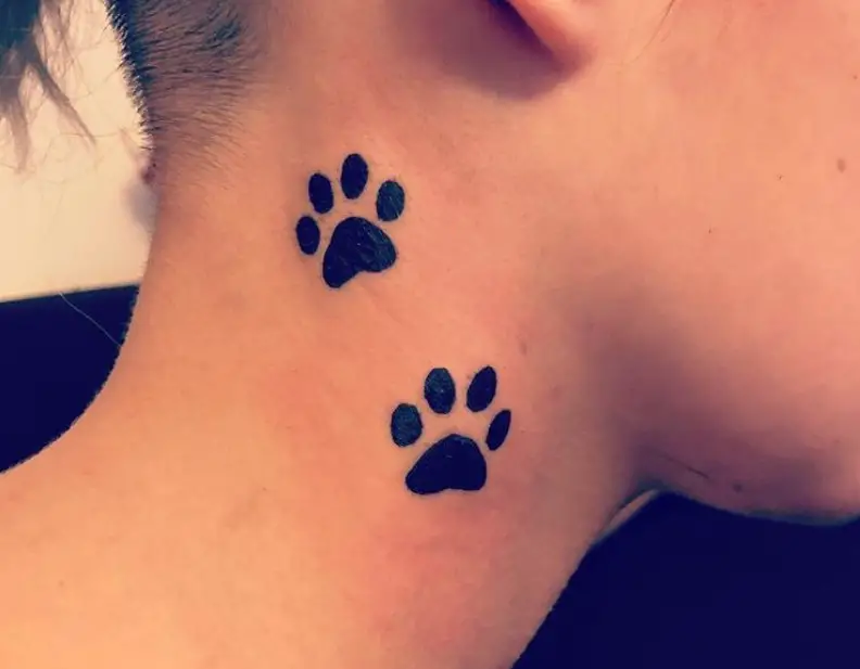two paw prints tattoo on neck