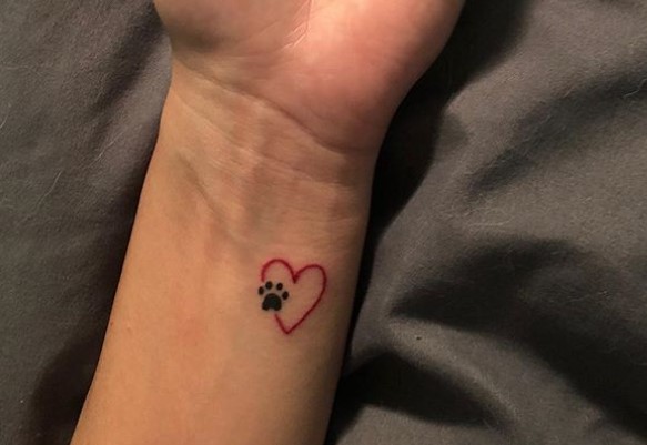 heart with paw tattoo on wrist