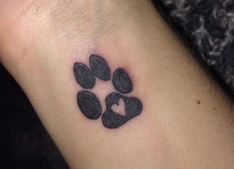 medium sized paw print with heart tattoo on wrist